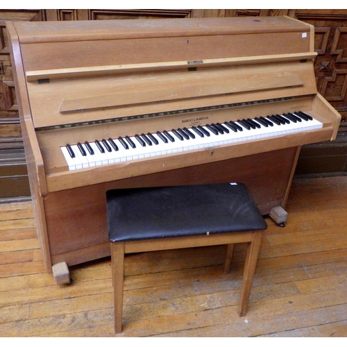 744 - A light oak upright piano, 