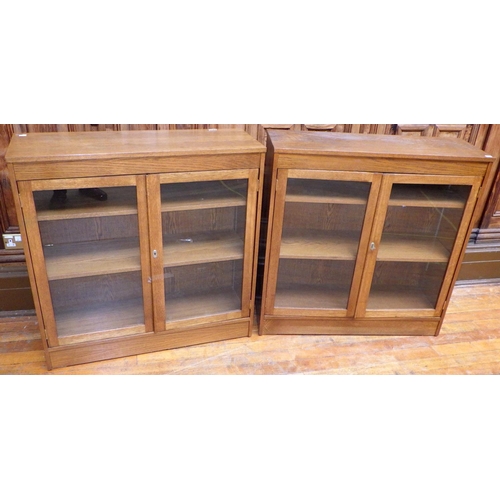 754 - Two low glazed modern bookcases, 100cm wide, ex Bootham Park Hospital