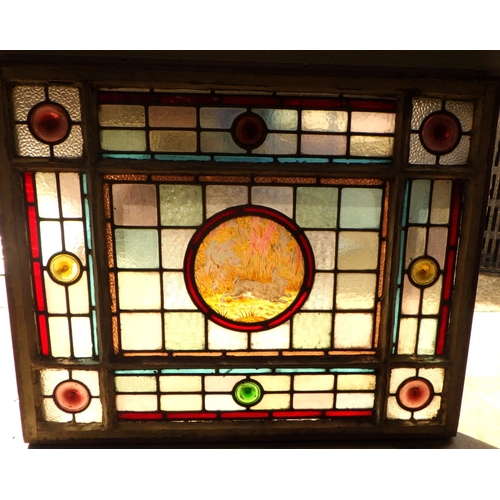 A Victorian leaded glass panel with dog chasing a hare in the centre, 84cm x 68cm,  ex Bootham Park Hospital