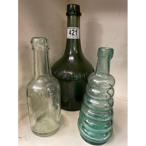 421 - A vintage Benedictine bottle, LNER bottle and a ribbed bottle (3)