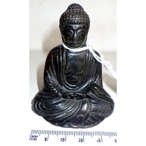 454 - An Amida Nyorai Buddha figurine, Japanese hollow cast bronze weighted.  7cm tall