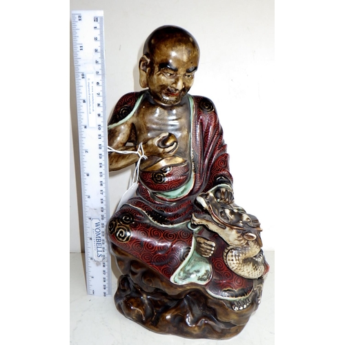 455 - A ceramic statuette / figurine possibly depicting a Chinese Immortal - Lu Dongbin? Zhongli Quan?  Ha... 