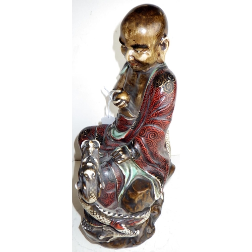 455 - A ceramic statuette / figurine possibly depicting a Chinese Immortal - Lu Dongbin? Zhongli Quan?  Ha... 