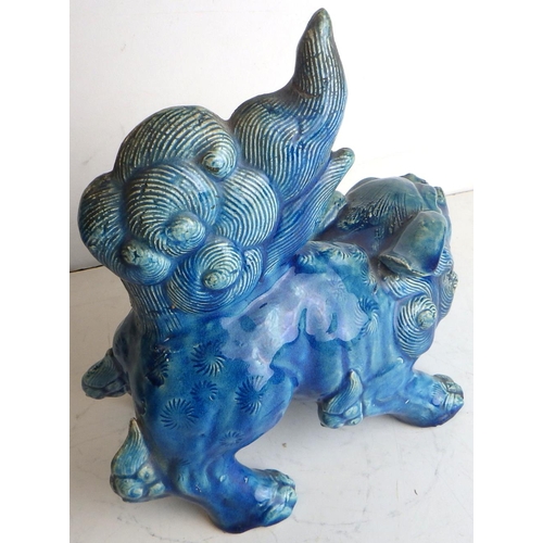 457 - A Chinese pottery blue glazed dog of fo figurine, a/f breaks and repairs, 19.5cm tall floor to tip o... 