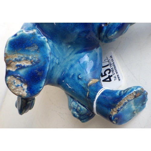 457 - A Chinese pottery blue glazed dog of fo figurine, a/f breaks and repairs, 19.5cm tall floor to tip o... 