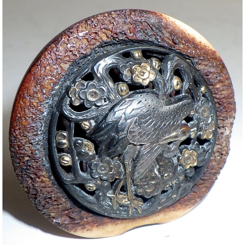 468 - A Japanese manju netsuke, bone with cast pierced central roundel depicting a standing stork.  Approx... 