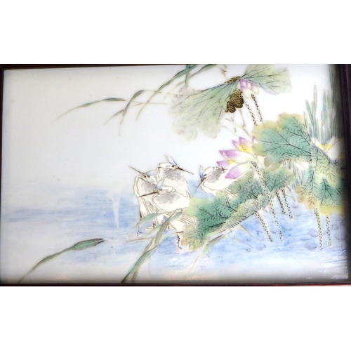 476 - A Chinese porcelain plaque painted with storks and lotus flowers at a lake edge, 18.5 x 11.5cm withi... 