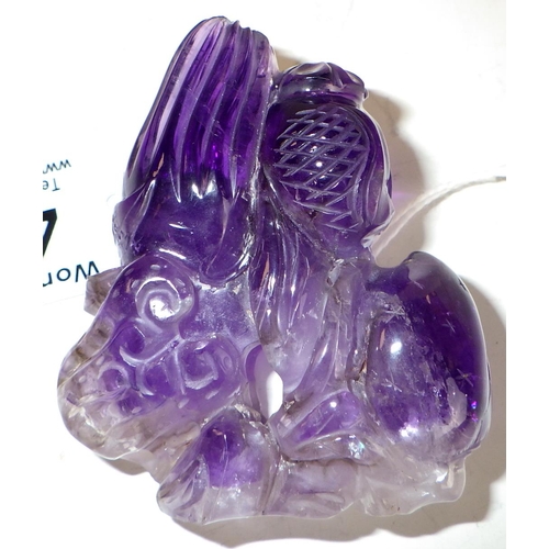 481 - A Chinese purple jade carving depicting foliage and fruit. 7cm tall