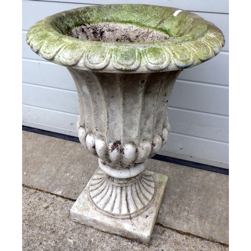 912 - A fluted concrete garden urn, 67cm tall