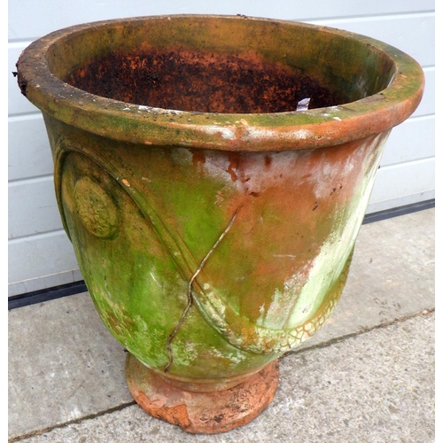 913 - A terracotta garden planter chip to base, 56cm tall