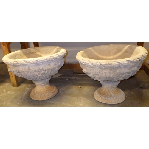 916 - A pair of concrete garden urns, 42cm tall