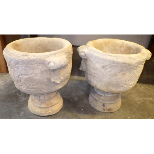 917 - A pair of concrete garden urns 45cm tall