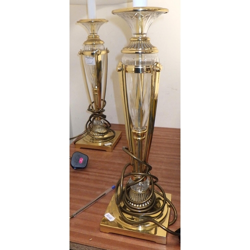 561 - A pair of brass and glass table lamps