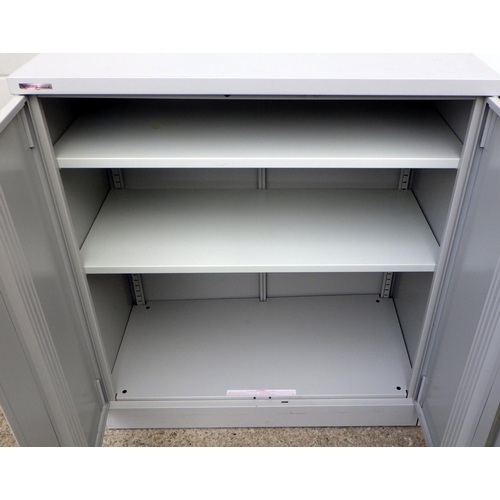 924 - A Micky Flanagan decorated low metal office cupboard and another, one without shelves, 92cm wide