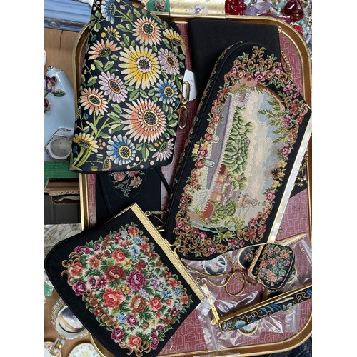498 - A group of embroidered purses, pill boxes, etc