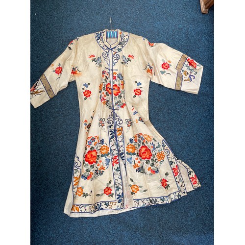 591 - A Chinses embroidered silk robe, af stains