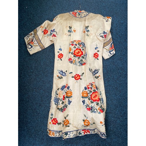 591 - A Chinses embroidered silk robe, af stains