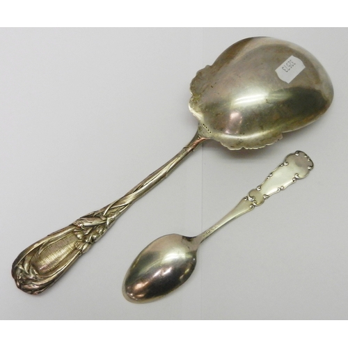 12 - An Art Nouveau berry spoon, white metal marked Sterling 