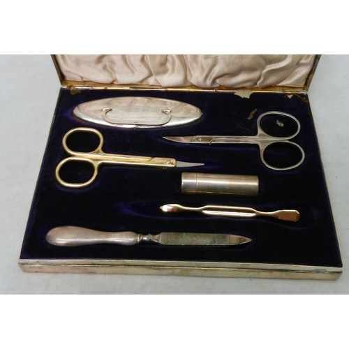 32 - A silver and hardwood cased manicure set, 20th cent, some contents lacking, box a/f; a silver evenin... 