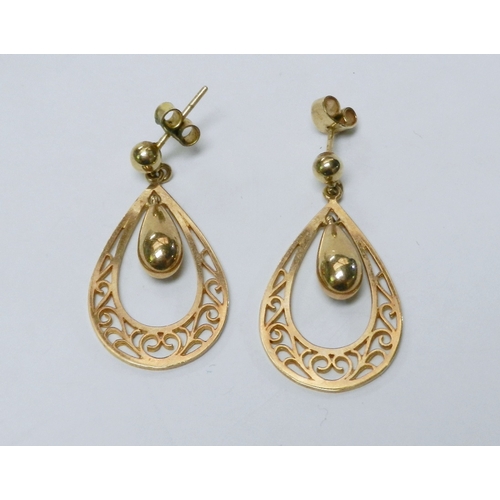 63 - A pair of droplet earrings comprising a suspended pear-drop within a pierced hoop, 9ct gold.  32mm l... 