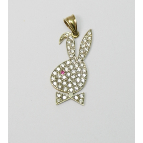 104 - A pendant in the form of a stylized rabbit head, loosely based on the Playboy logo, 9ct gold and dia... 