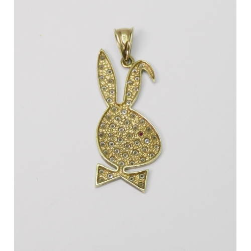 104 - A pendant in the form of a stylized rabbit head, loosely based on the Playboy logo, 9ct gold and dia... 