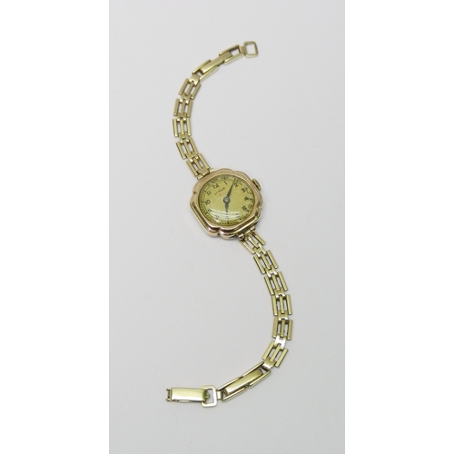 113 - An Audax ladies 9ct gold bracelet watch.  21mm across head / 180mm long incl strap / 14g gross