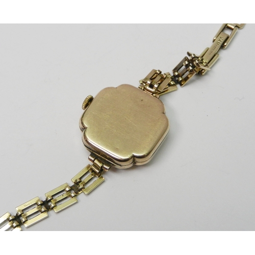 113 - An Audax ladies 9ct gold bracelet watch.  21mm across head / 180mm long incl strap / 14g gross