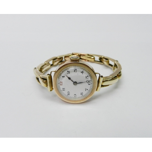 116 - A ladies wire lug wristwatch having a 15 jewel manual wind movement, the whole on a sprung yellow me... 