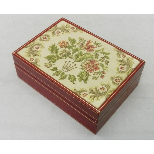 117 - A Rolex watch box, red leather having woven floral design lid.  180 x 128mm