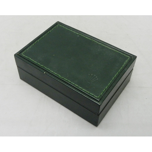 118 - A Rolex watch box, green leather.  145 x 104mm