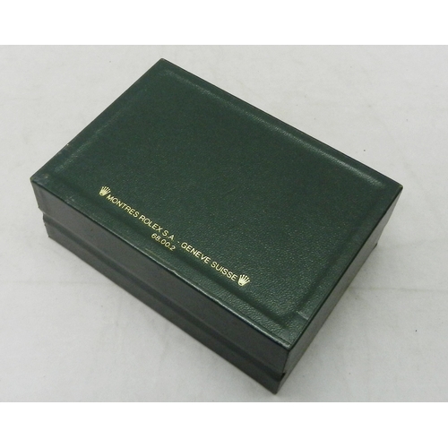 118 - A Rolex watch box, green leather.  145 x 104mm