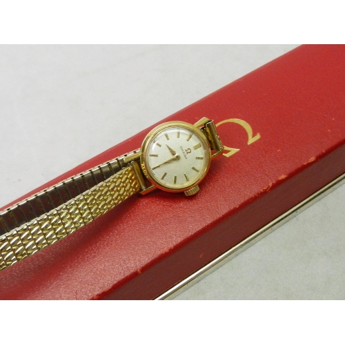 120 - A ladies gold plated Omega wristwatch, 17mm across head, in original box; a Dutch white metal caddy ... 