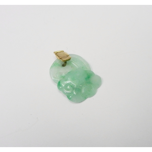 90 - A jade pendant carved with a bird in foliage motif design, 55mm long incl yellow metal suspension lo... 