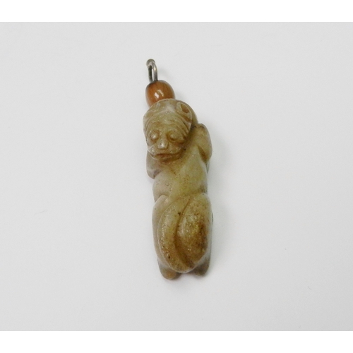 92 - An archaistic jade figure of a Qiling as a pendant, carved depicted looking backwards towards its ta... 