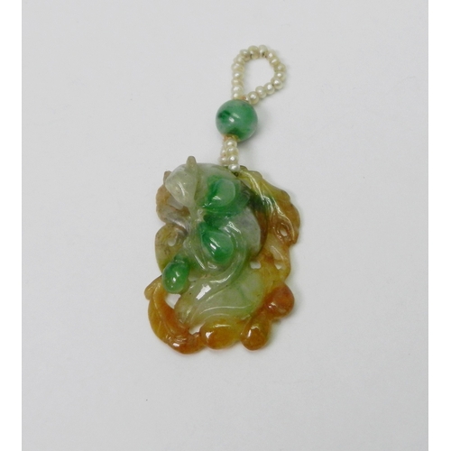 99 - A jade pendant carved with a design incorporating a rat, the whole suspended on a seed pearl and bea... 