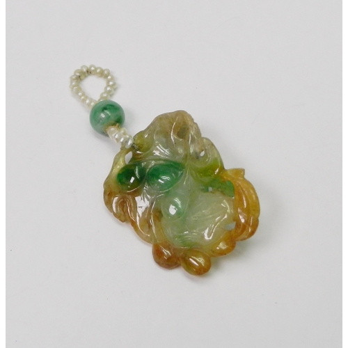 99 - A jade pendant carved with a design incorporating a rat, the whole suspended on a seed pearl and bea... 