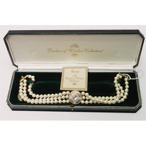 128 - A Harrods The Duchess of Windsor Collection choker necklace, comprising three strands of faux pearls... 