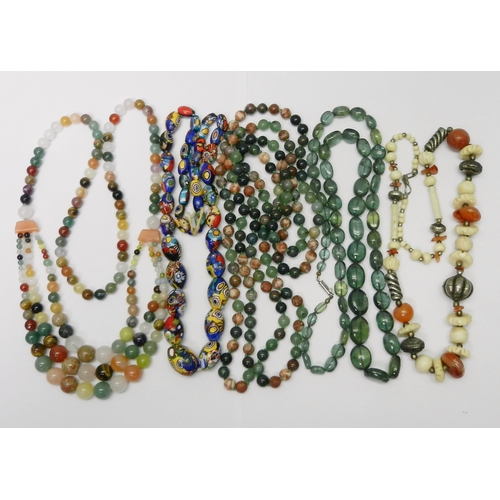 143 - Five bead necklaces incl a carnelian, bone and white metal example believed African, and a millefior... 