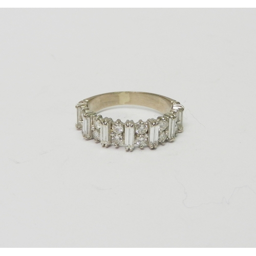 171 - A half hoop eternity style ring comprising 16 round cut diamonds arranged in pairs spaced with seven... 