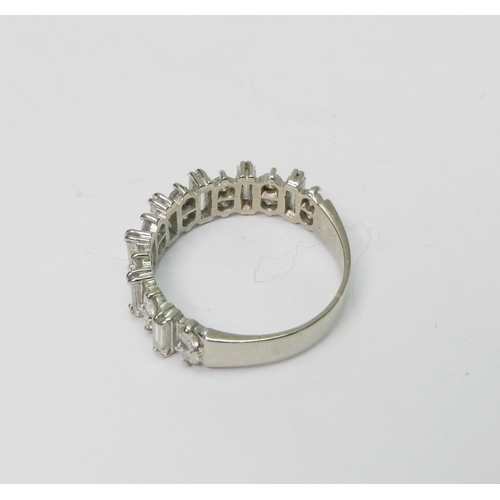 171 - A half hoop eternity style ring comprising 16 round cut diamonds arranged in pairs spaced with seven... 