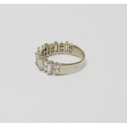 171 - A half hoop eternity style ring comprising 16 round cut diamonds arranged in pairs spaced with seven... 