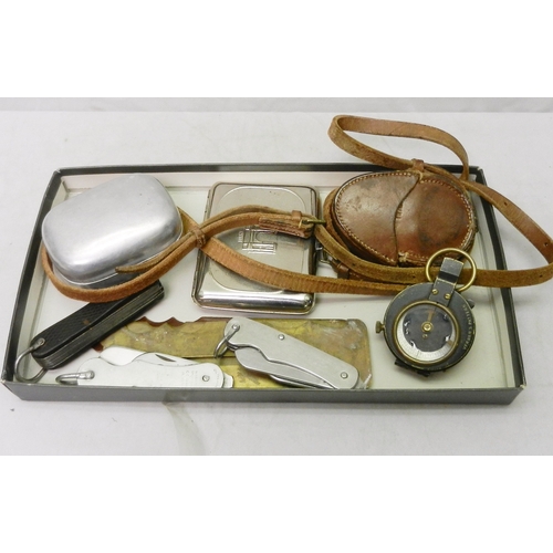 180 - A British Army marching compass dated 1917, cased; a three British army pocket knives, etc.