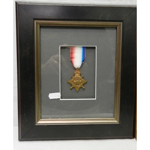 182 - Two frames of WW1 interest medals: a single 1914 / 15 Star; a War Medal and Victory Medal pair with ... 