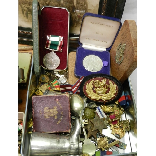 185 - A group of British army and other badges etc; a WVS medal; miniature medals; other militaria incl a ... 