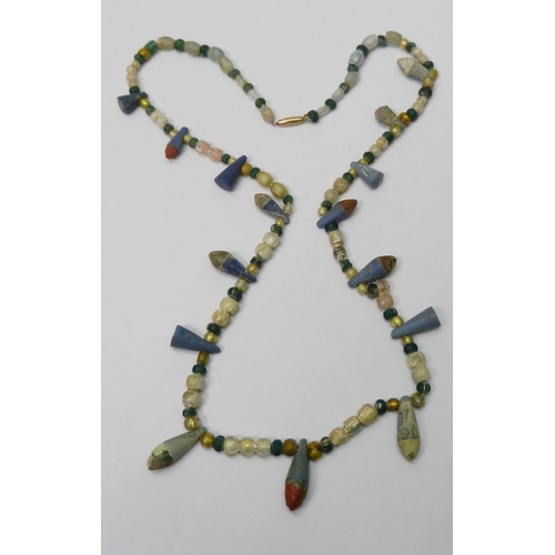 191 - Antiquarian interest: two strung necklaces of beads, including Ancient Egyptian interest, one featur... 