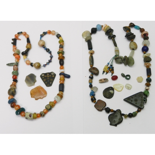 192 - Antiquarian interest: two strung bead necklaces including carnelian stones; a group of loose beads. ... 