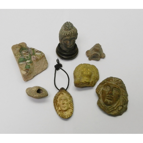 193 - Including Antiquarian interest: an ancient Indian fragment depicting a head and face, believed Gupta... 