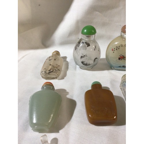 462 - A Chinese hardstone scent bottle carved to both sides with depictions of a standing horse; a Chinese... 