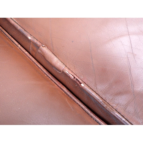 605 - A brown button leather chesterfield sofa, 205cm wide, piping a/f